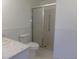 Bright bathroom featuring a walk-in shower with glass door at 580 S Clinton St # 10D, Denver, CO 80247