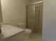 Bright bathroom featuring a walk-in shower with glass door at 580 S Clinton St # 10D, Denver, CO 80247