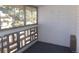 Enclosed balcony with windows and a brick wall, offering private outdoor space at 580 S Clinton St # 10D, Denver, CO 80247