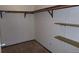 Spacious walk-in closet with rods and shelving units at 580 S Clinton St # 10D, Denver, CO 80247