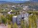 An exterior view of the home featuring mountain and forest views at 10354 Georgia Cir, Morrison, CO 80465