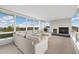 Bright living room features a fireplace, carpeting and expansive windows with mountain views at 10354 Georgia Cir, Morrison, CO 80465