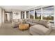 Open living room with comfortable seating and a round wood table with amazing natural light at 10354 Georgia Cir, Morrison, CO 80465