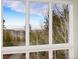 Large windows offer serene mountain views in a nature filled setting at 10354 Georgia Cir, Morrison, CO 80465