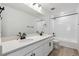 Contemporary bathroom with dual sinks and a shower-tub combo at 9253 Truckee Ct, Commerce City, CO 80022