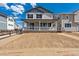 Charming two-story home with a covered front porch and unfinished front yard at 9253 Truckee Ct, Commerce City, CO 80022