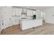 Stylish kitchen with a large island, sleek countertops, and modern appliances for convenient cooking at 9253 Truckee Ct, Commerce City, CO 80022