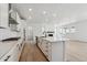 Modern kitchen featuring an island, stainless appliances, and plenty of cabinet space at 9253 Truckee Ct, Commerce City, CO 80022