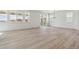 Spacious living area with large windows and a sliding glass door at 9253 Truckee Ct, Commerce City, CO 80022