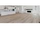 Spacious kitchen and living area with a fireplace at 9253 Truckee Ct, Commerce City, CO 80022