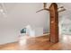 Spacious attic conversion with exposed brick chimney, hardwood floors, and bright natural light at 3905 Tejon St, Denver, CO 80211