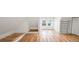 Bright attic featuring hardwood floors, a window seat, and a modern, industrial-style shelving unit at 3905 Tejon St, Denver, CO 80211