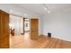 Bright bedroom featuring hardwood floors, neutral walls and classic doors at 3905 Tejon St, Denver, CO 80211