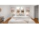 Bright bedroom featuring neutral decor, hardwood floors, and natural light creating a calming and restful retreat at 3905 Tejon St, Denver, CO 80211