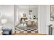 Elegant dining room boasts black and white tile floors, a modern table, and decor at 3905 Tejon St, Denver, CO 80211