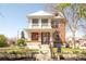 Charming two-story brick home with a covered front porch and well-manicured landscaping at 3905 Tejon St, Denver, CO 80211