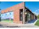Charming brick building with colorful mural and a barber shop with a vintage barber pole at 3905 Tejon St, Denver, CO 80211