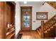 Inviting foyer with hardwood floors, wooden staircase, and stained glass window above the front door at 3905 Tejon St, Denver, CO 80211