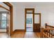 Inviting hallway with original wood trim, hardwood floors, and decorative doorway highlighting the home's character at 3905 Tejon St, Denver, CO 80211