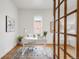 Home office with natural light, neutral decor, and wood-trimmed glass door at 3905 Tejon St, Denver, CO 80211