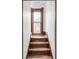 A staircase with detailed wood trim around a window at 3905 Tejon St, Denver, CO 80211