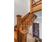 Classic wooden staircase featuring detailed woodwork and natural light, enhancing the home's architectural charm at 3905 Tejon St, Denver, CO 80211