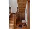 Wooden staircase with detailed trim and a decorative bench on the ground floor at 3905 Tejon St, Denver, CO 80211