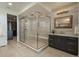 Sleek bathroom with a glass-enclosed shower, stylish vanity, and modern fixtures at 5866 Boston Ct, Denver, CO 80238