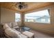 Comfortable covered patio with outdoor furniture and neighborhood views at 5866 Boston Ct, Denver, CO 80238