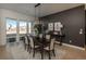 Dining room featuring modern lighting, stylish decor, large windows, and a view of the neighborhood at 5866 Boston Ct, Denver, CO 80238