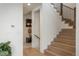 Welcoming entryway with hardwood floors and staircase, leading to the upper level at 5866 Boston Ct, Denver, CO 80238