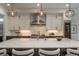 Bright kitchen showcases marble countertops, stylish pendant lights, and stainless steel appliances at 5866 Boston Ct, Denver, CO 80238