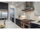 Well-equipped kitchen featuring marble countertops, stainless steel appliances, and ample cabinet space at 5866 Boston Ct, Denver, CO 80238