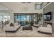 Bright living room featuring modern furniture, a fireplace, a large sliding glass door, and an open floor plan at 5866 Boston Ct, Denver, CO 80238