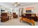 Spacious living room showing access to the dining room, kitchen, and front door at 9421 Morning Glory Ln, Highlands Ranch, CO 80130