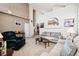 Spacious living room featuring neutral walls, plush carpet, and comfortable seating arrangement at 9421 Morning Glory Ln, Highlands Ranch, CO 80130