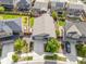 An aerial view of a single-Gathering home showcasing its well-manicured lawn, fenced backyard, and neighborhood surroundings at 9628 Albion Ln, Thornton, CO 80229