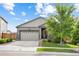 Charming single-Gathering home with a two-car garage, stone accents, and a well-kept lawn in a suburban neighborhood at 9628 Albion Ln, Thornton, CO 80229