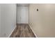 Bright entryway featuring wood-look floors and a white front door at 9628 Albion Ln, Thornton, CO 80229