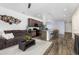 Inviting living room with a connecting open kitchen and dining area, perfect for entertaining guests at 9628 Albion Ln, Thornton, CO 80229
