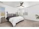 Bright main bedroom features lots of natural light, carpet, and ceiling fan at 9628 Albion Ln, Thornton, CO 80229