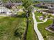 An aerial view of the walking path, stream, and park near the residence, showcasing neighborhood recreation areas at 9628 Albion Ln, Thornton, CO 80229