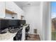 A bright home office with granite countertops, modern cabinetry, and a window at 9628 Albion Ln, Thornton, CO 80229
