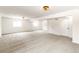 Spacious basement with neutral carpet, white walls, and ample natural light from windows at 14126 W Harvard Pl, Lakewood, CO 80228