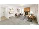 Bright living room includes a modern fireplace and curated shelving, perfect for relaxation and entertaining at 14126 W Harvard Pl, Lakewood, CO 80228