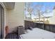 Small deck with snow and view of other homes at 19921 Victorian Way, Parker, CO 80138