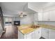 Modern kitchen with stainless steel appliances and view of living room at 19921 Victorian Way, Parker, CO 80138