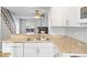 Modern kitchen with a view of the living room and fireplace at 19921 Victorian Way, Parker, CO 80138