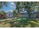 Large backyard with a detached garage and grassy area at 1875 Jay St, Lakewood, CO 80214