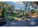 Landscaped backyard with a deck and gravel patio at 1875 Jay St, Lakewood, CO 80214